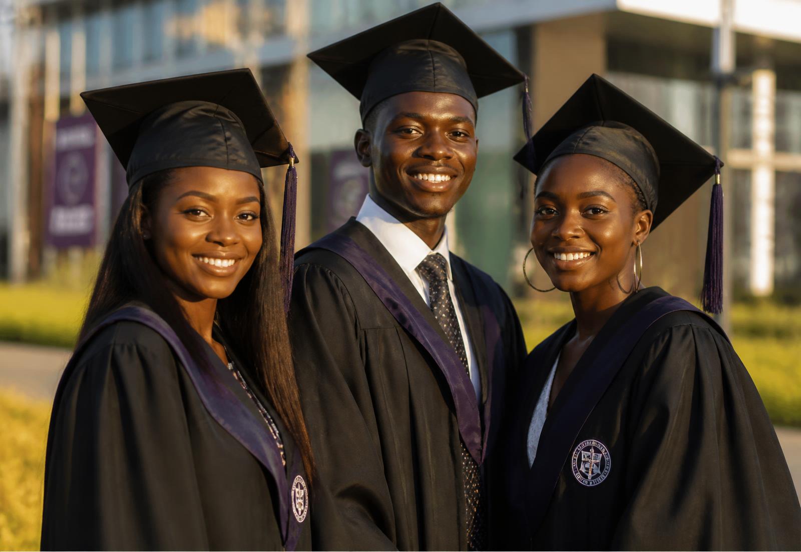 Kenyan university graduates in caps and gowns celebrating on campus